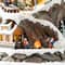 Glitzhome® 15.5" Lighted Christmas Skiing Moutain Resin Village with Movement and Music